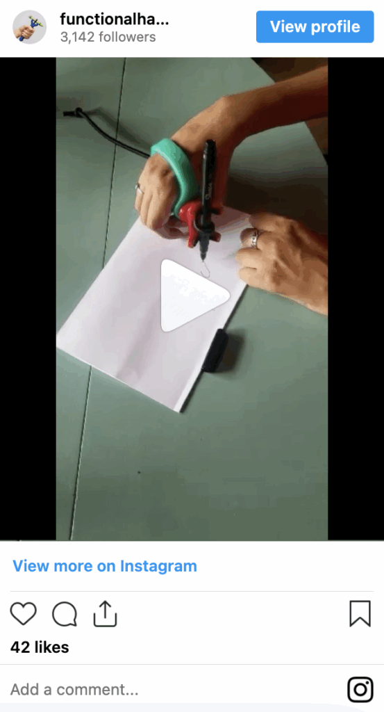 Person using the functionalhand® with the eazyhold® universal cuff to write.