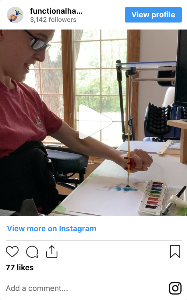 Person using the functionalhand® to paint