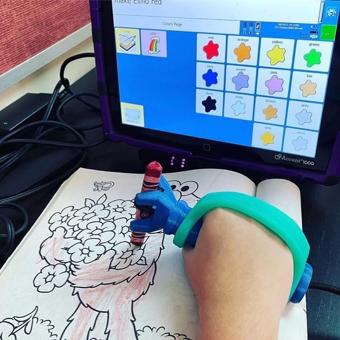 Students using functionalhand® adaptive equipment