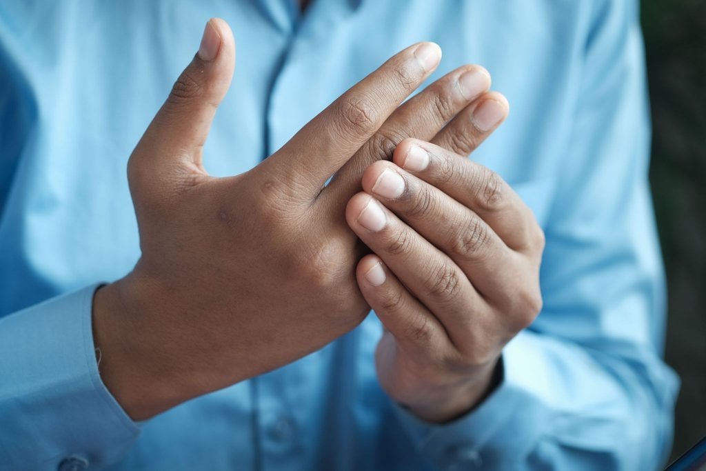 Adult showing hand chronic pain