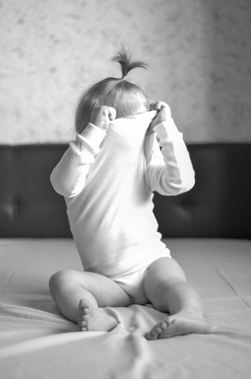 An image of a child dressing 