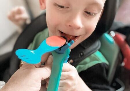 CP kid eating with spoon